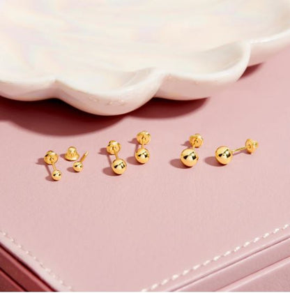 Aros redondos de oro amarillo de 18 k  con tornillo de seguridad