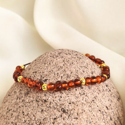 Pulsera de ámbar con balines bañados de oro